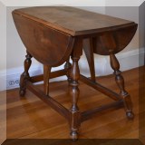 F11. Drop leaf side table with turned legs. Scratching on top. - $48 